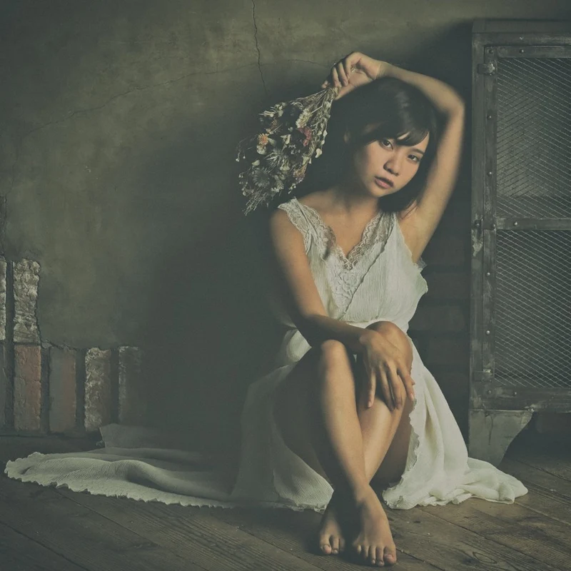 Contemplative Woman with Flowers