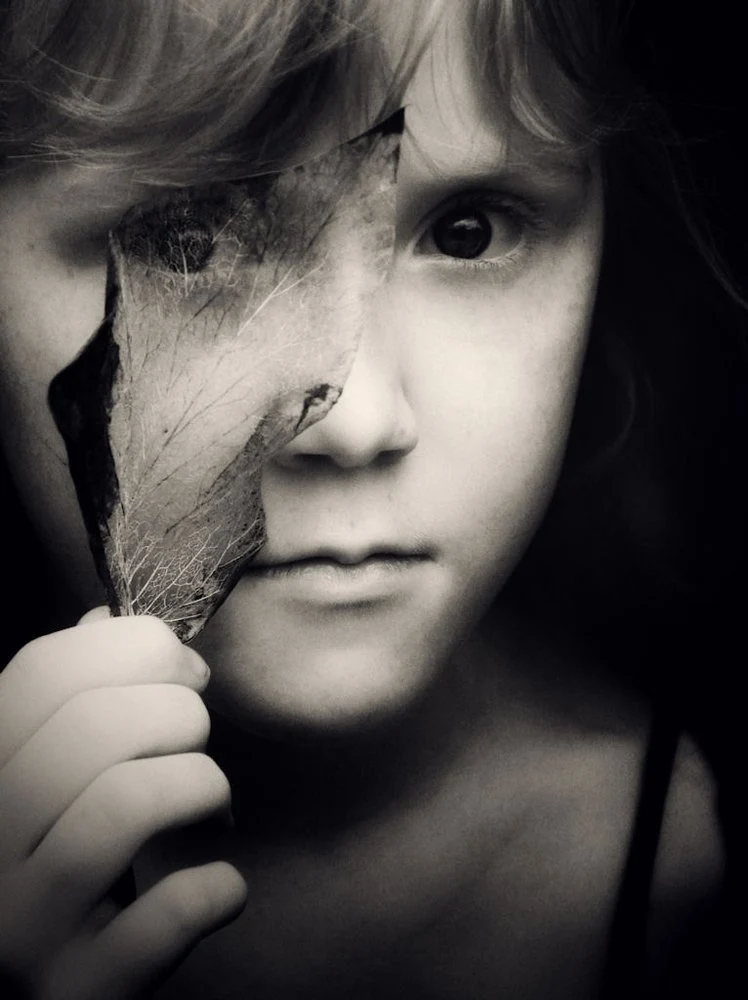 Child Behind Leaf
