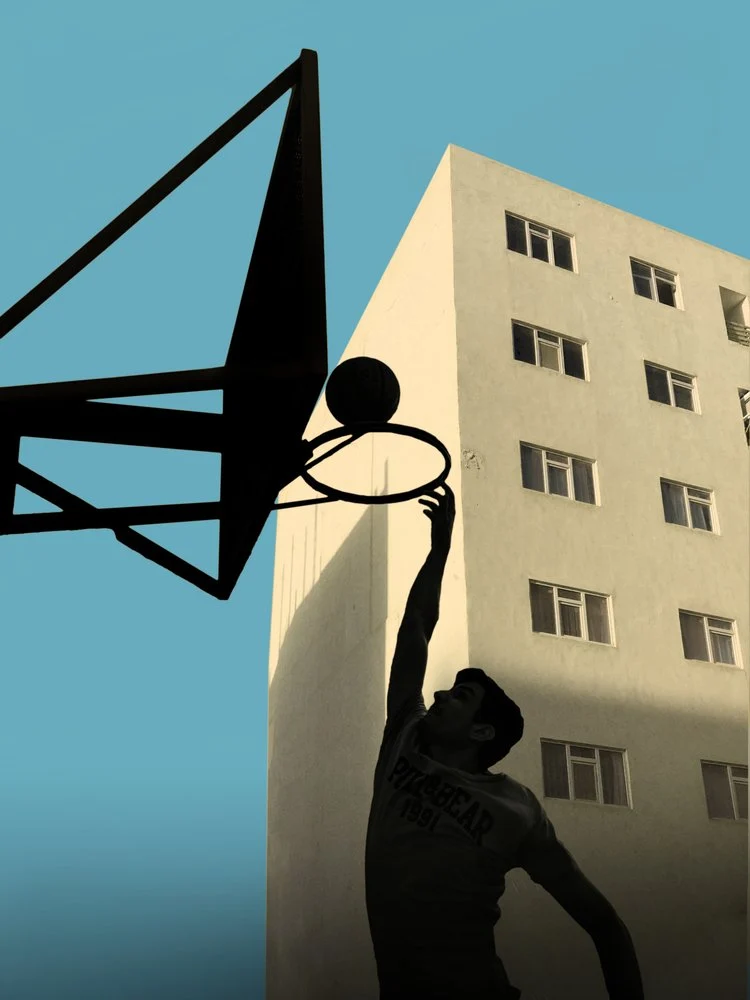 Dunking Against City Sky