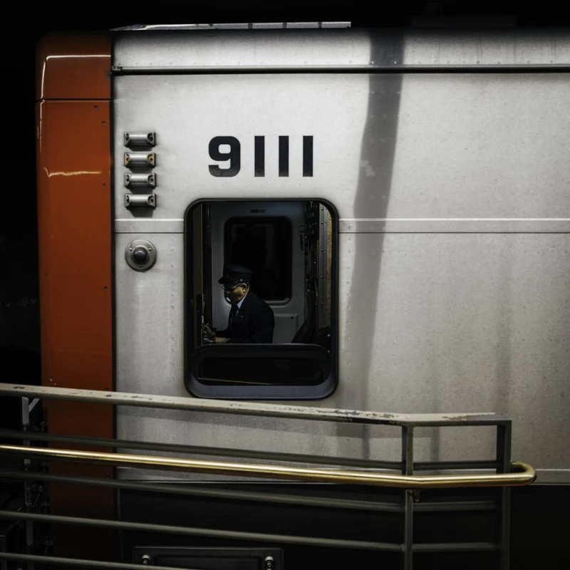 Pensive Subway Conductor