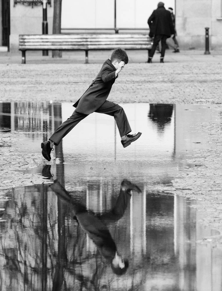 Boy Leaping Puddle