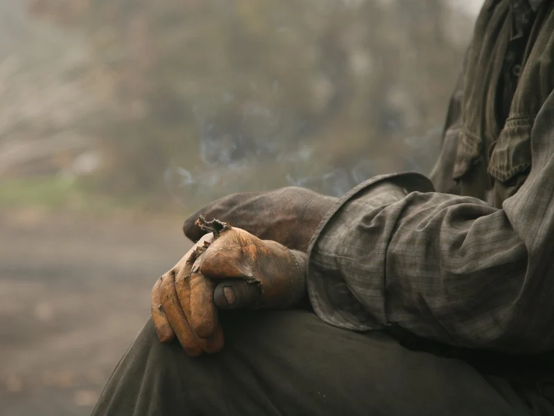 Worn Hands and Smoke