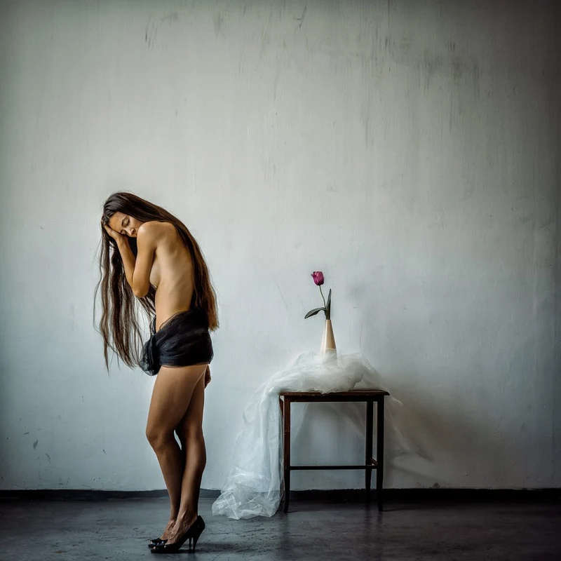 Pensive Woman and Rose
