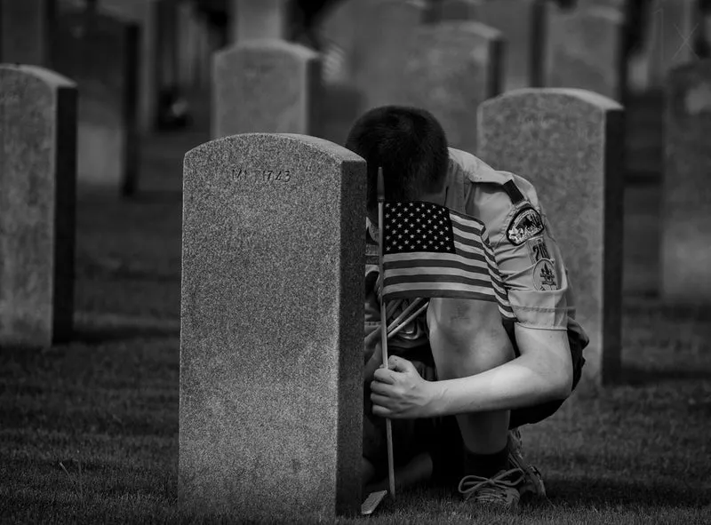 Boy Honors Military Grave