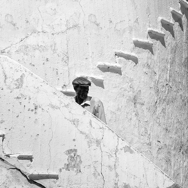 Man on Weathered Stairs