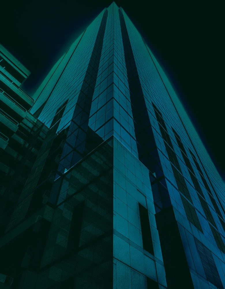 Sleek Teal Skyscraper