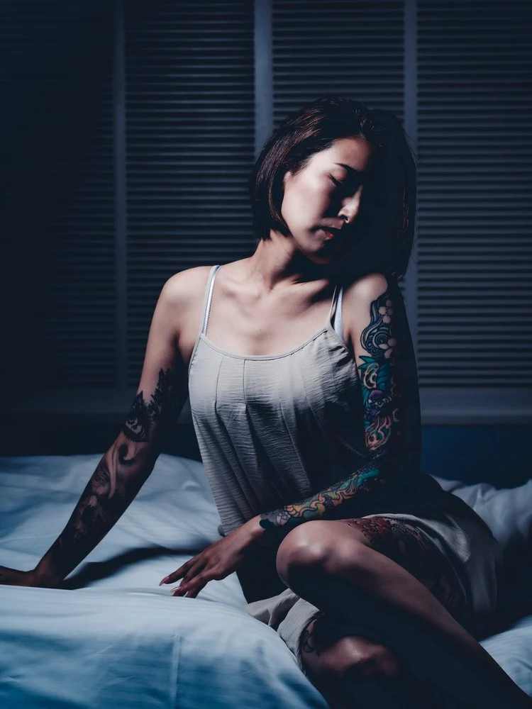 Pensive Woman on Bed