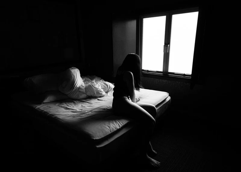 Pensive Woman By Window
