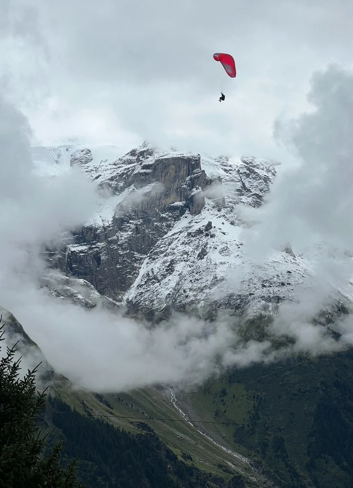 Red Paraglider Mountain Flight