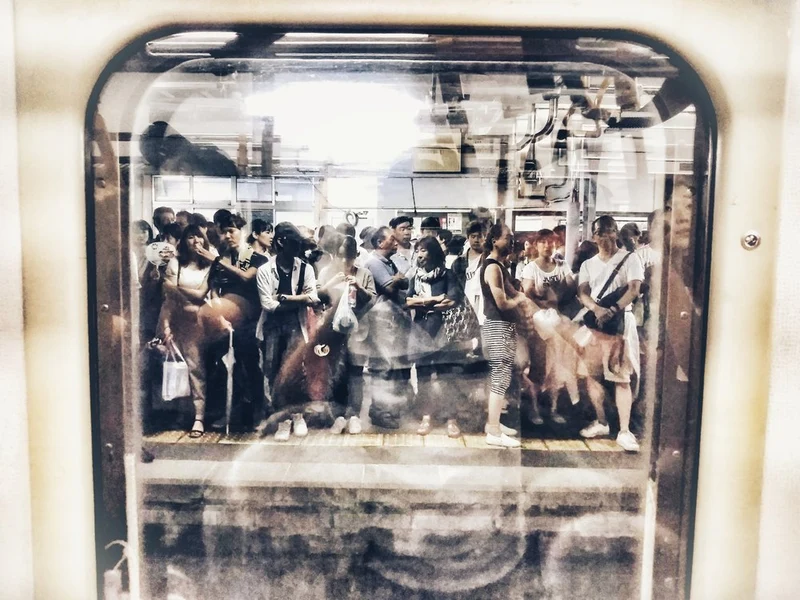 Commuters Through Window