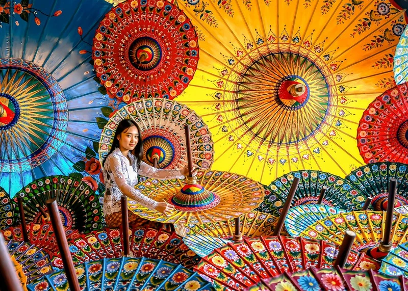 Balinese Woman Vibrant Umbrellas