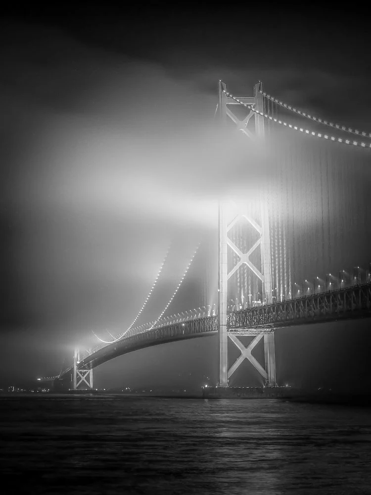 Dramatic Foggy Night Bridge