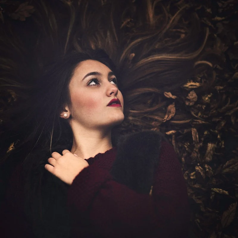 Woman Among Autumn Leaves
