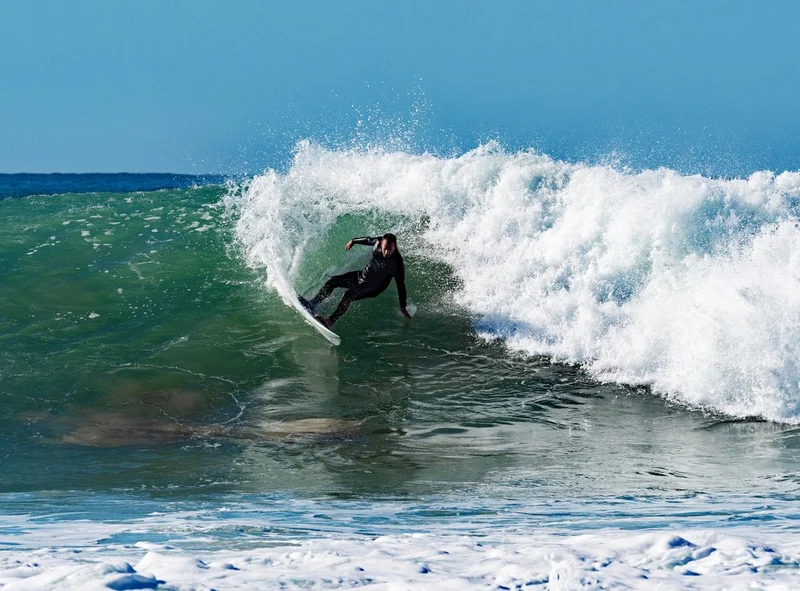Surfer Carving Wave