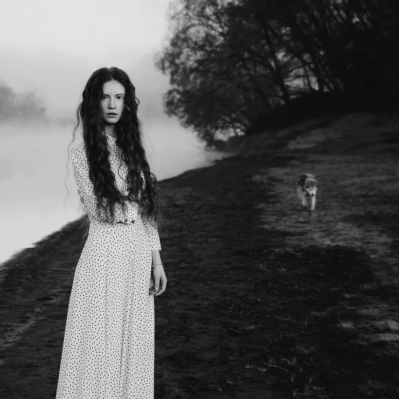 Woman and Wolf in Mist