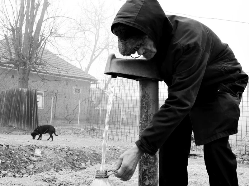 Man At The Water Pump