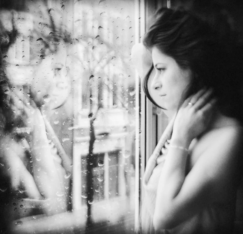Thoughtful Woman Rainy Window