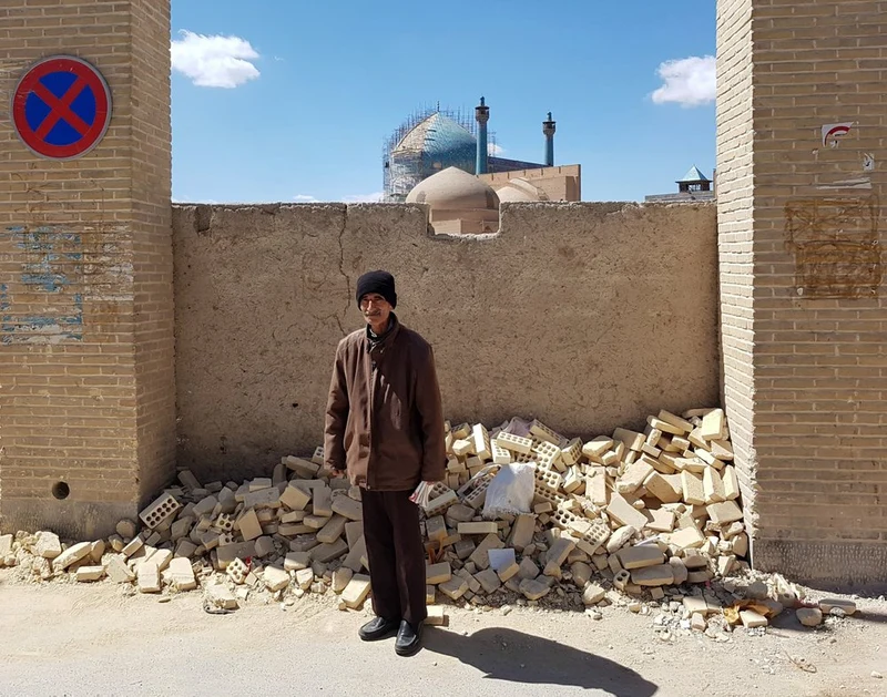Man by Ancient Mosque