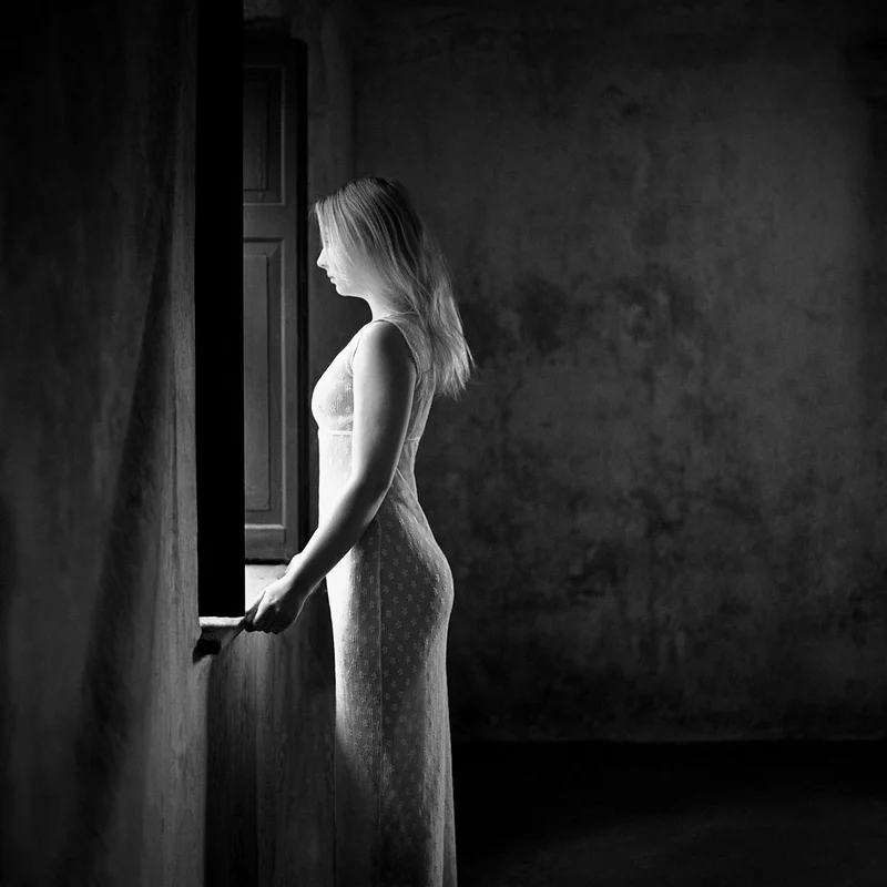 Pensive Woman By Window