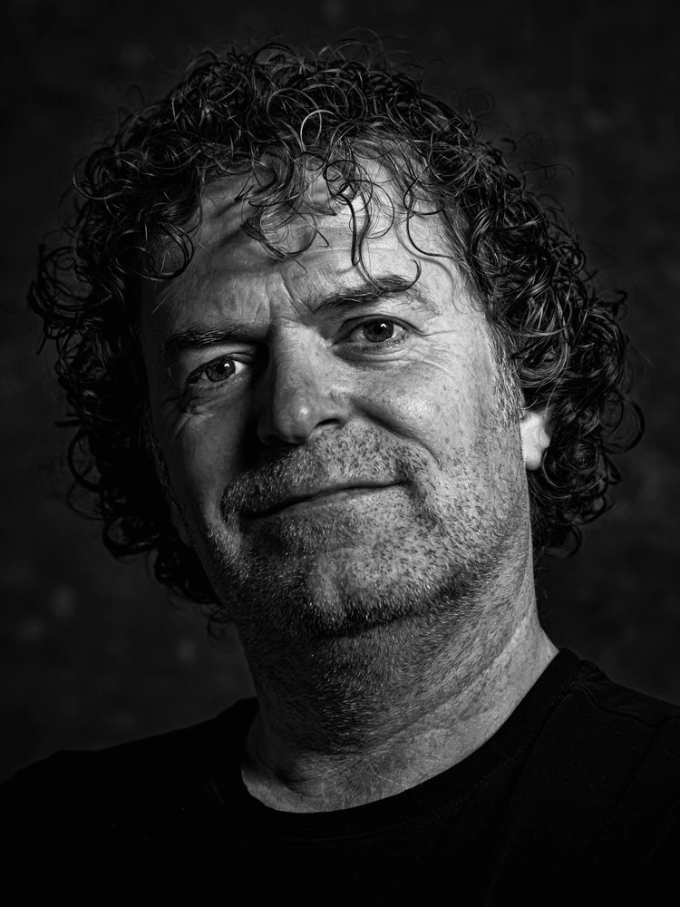 Smiling Man With Curly Hair