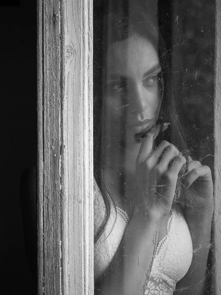 Pensive Woman Through Glass