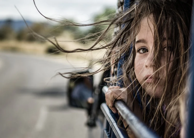 Windblown Child On Road