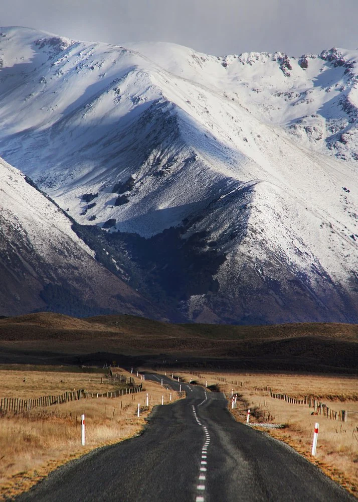 Winding Road Snowy Peaks