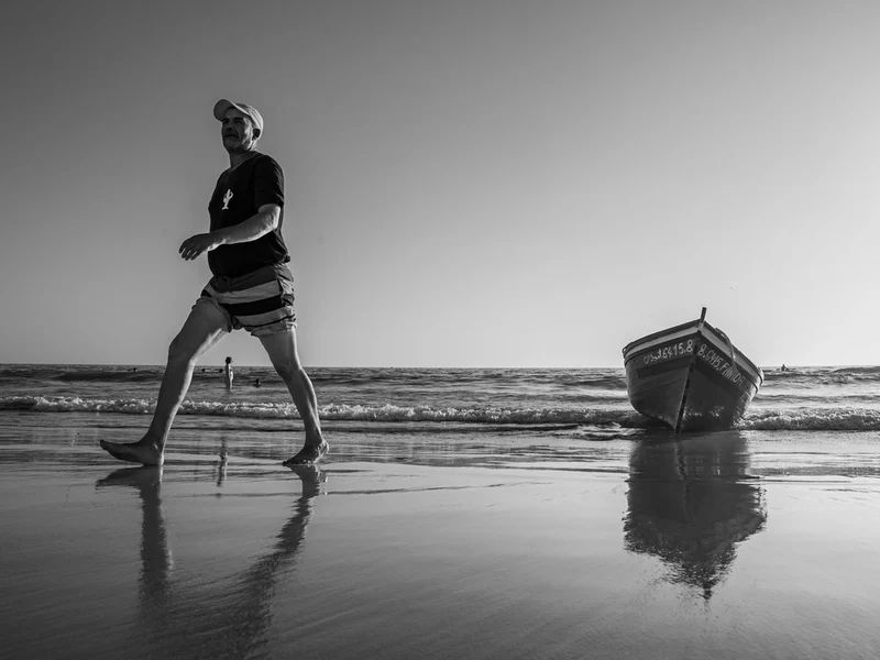 Beach Stroll And Boat