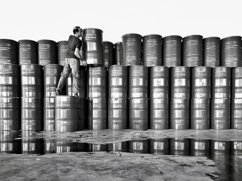 Worker Stacking Barrels