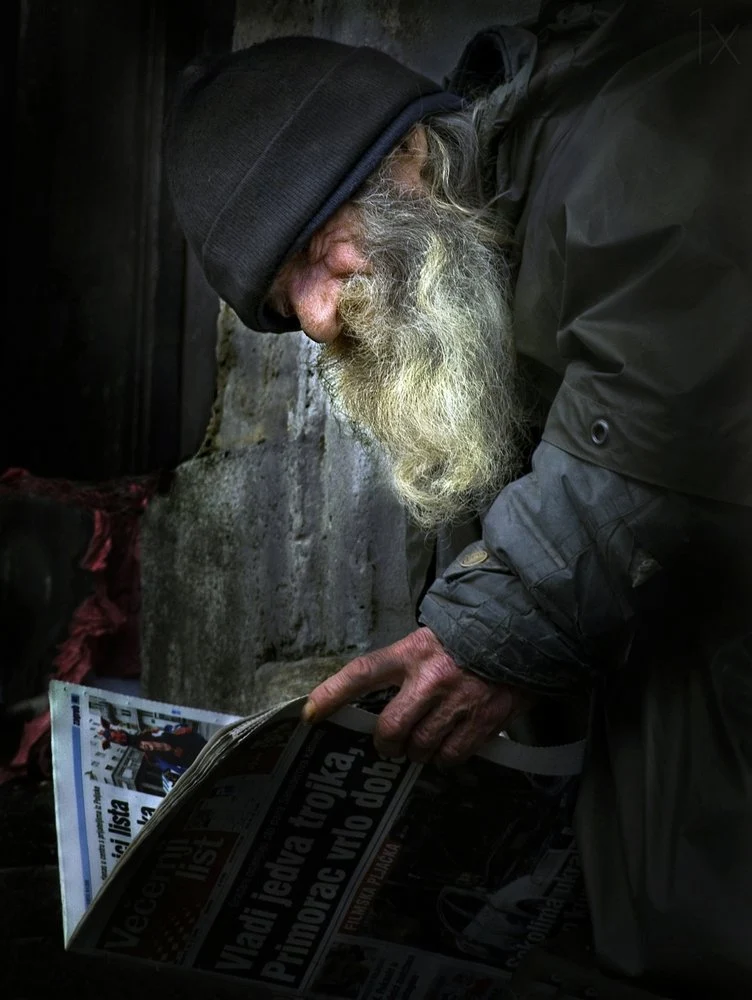 Bearded Man Reading News