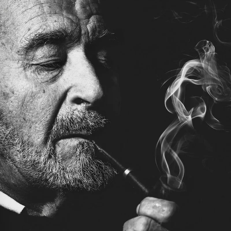 Pensive Man Smoking Pipe