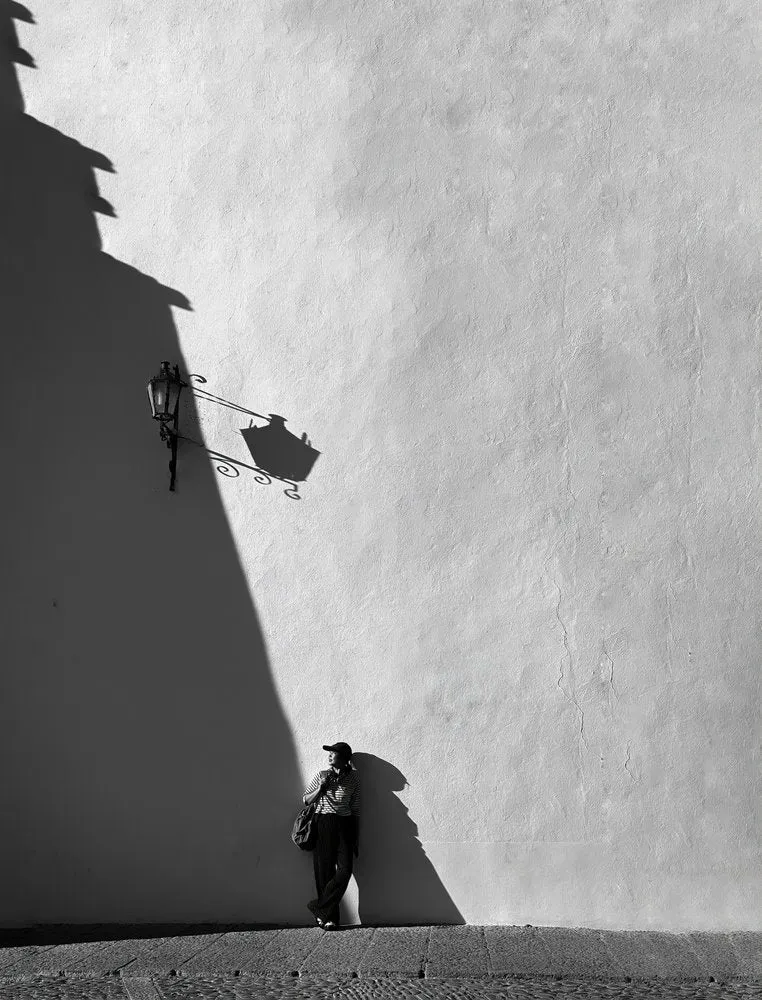Woman by Shadowed Wall