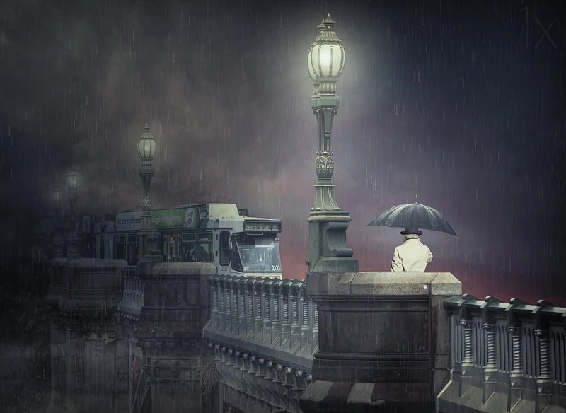 Man on Rainy Bridge