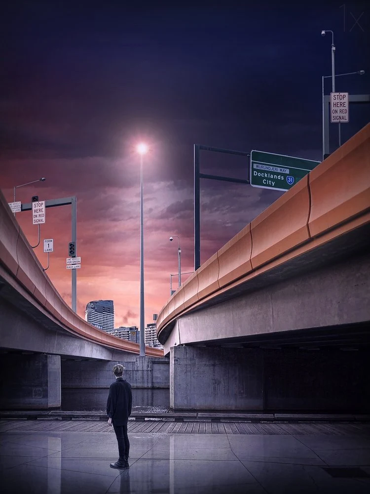 Man at Urban Crossroads