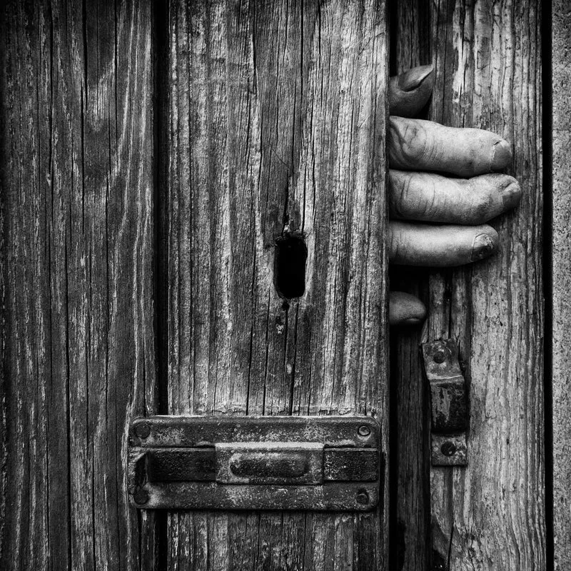 Hand Behind Old Door