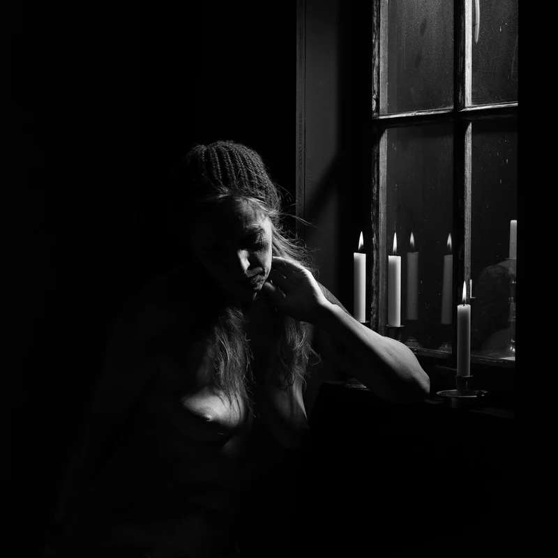 Pensive Woman Candlelight