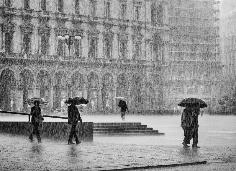 People Walking In Rain