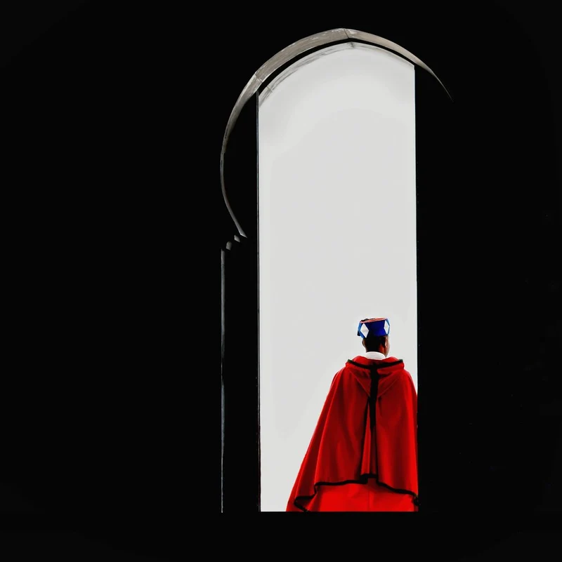 Man In Red Archway