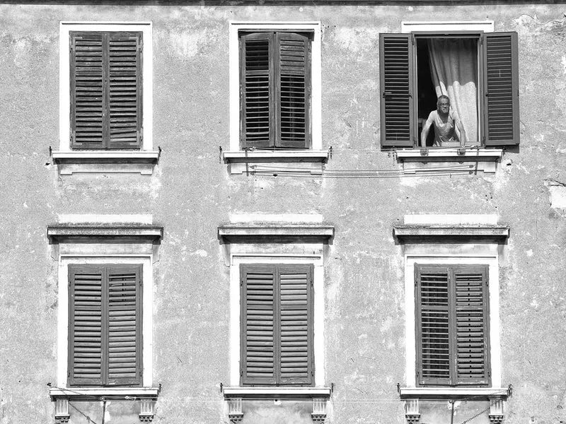 Man in Open Window