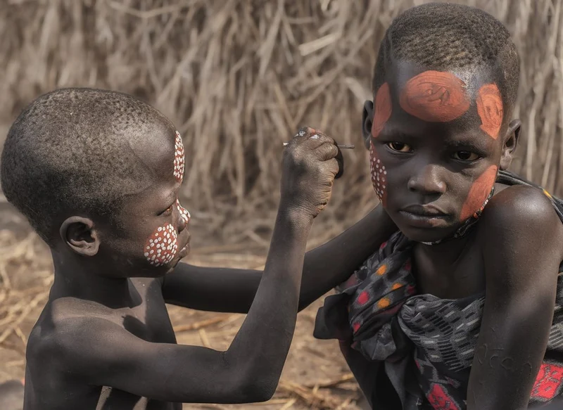 Tribal Children Painting Faces