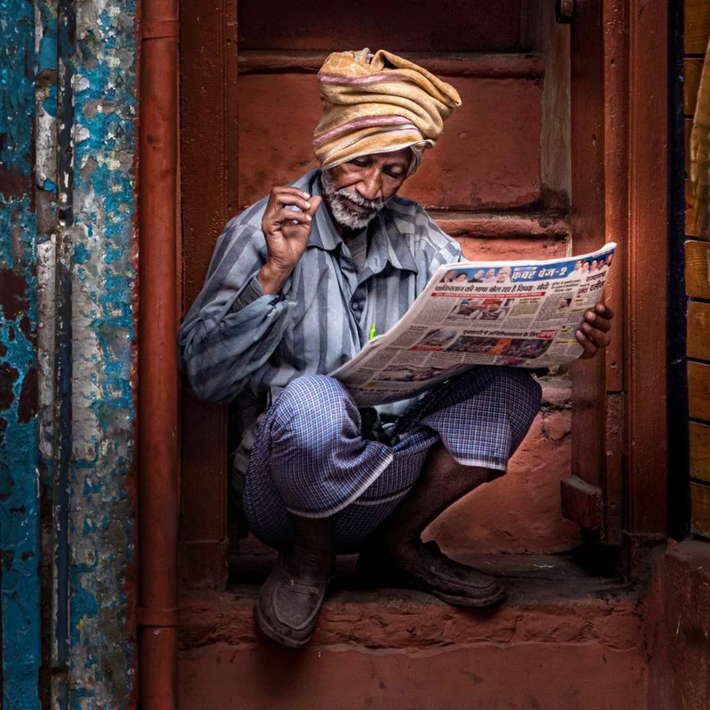 Indian Man Reading News