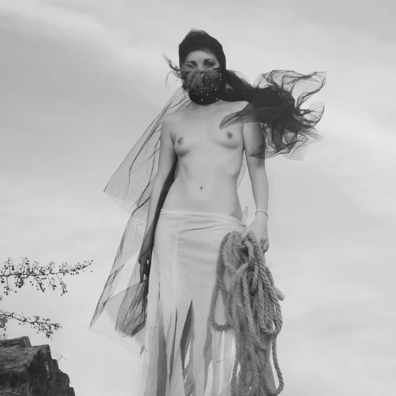 Veiled Woman Holding Rope