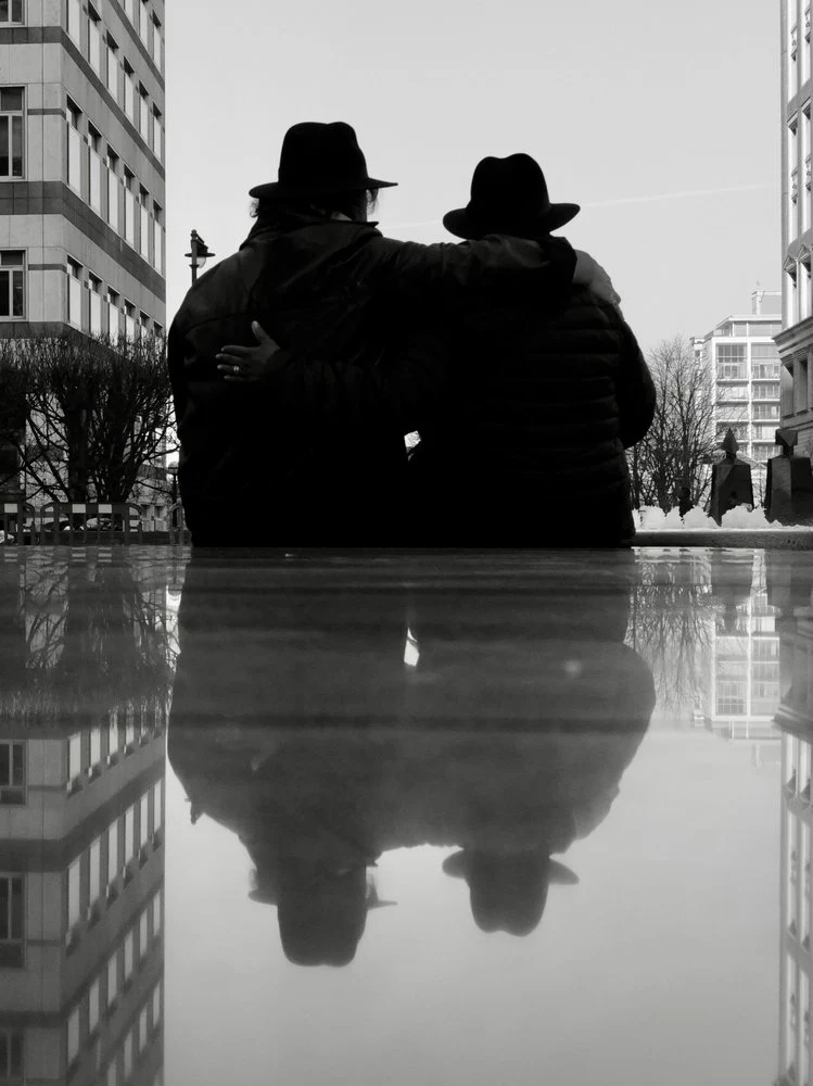 Hatted Couple Reflection
