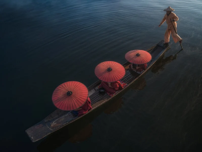 Leg Rower and Red Parasols