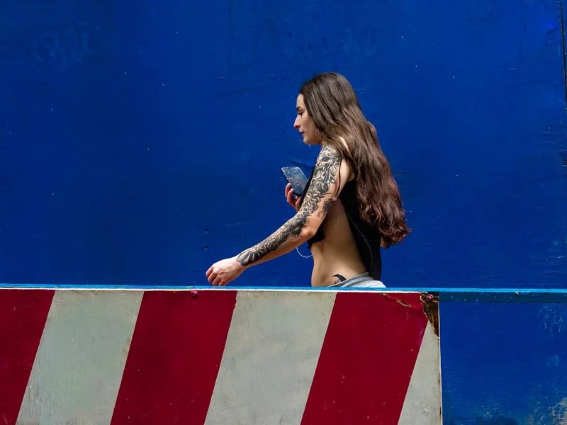 Tattooed Woman Blue Wall