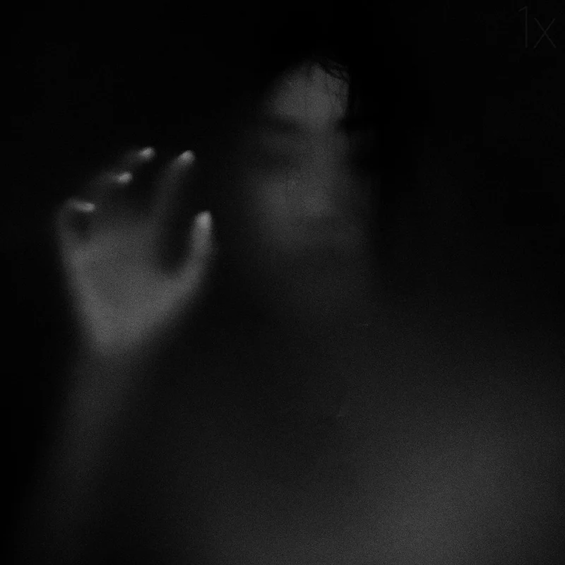 Blurred Figure Reaching