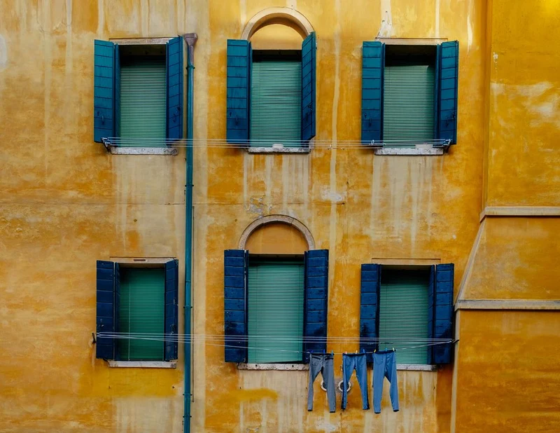 Yellow Facade Blue Shutters